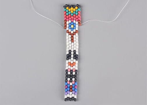 Five columns of seed beads, stitched together with an additional quarter-column on both sides
